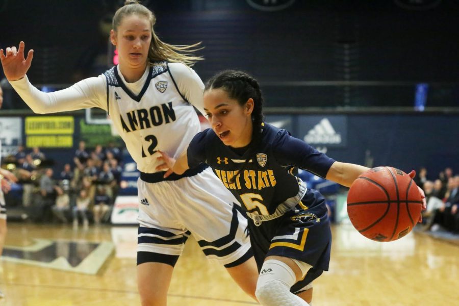 Mariah Modkins drives past Akron's Shayna Harmon during the first half of Kent State's game against the Zips on March 6. Kent State won, 65-55. 