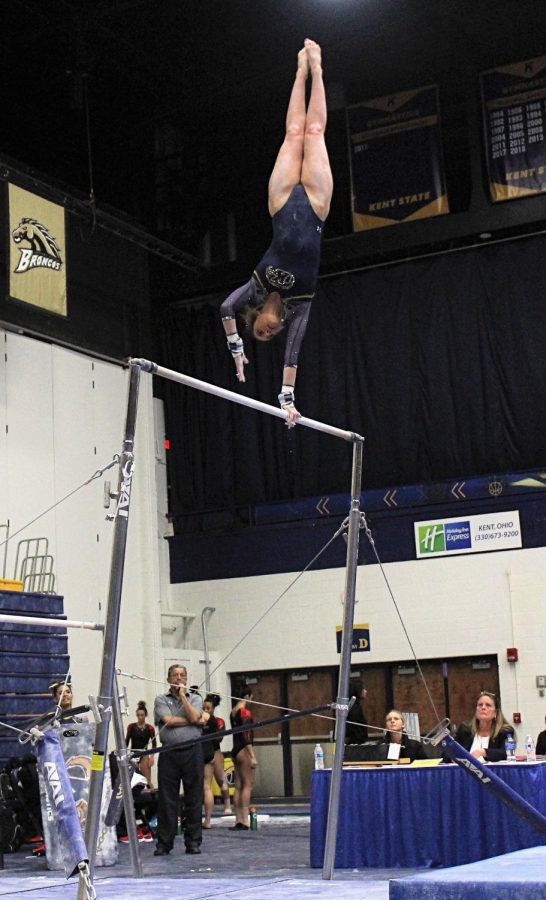 Sophomore Sydney Chapman performs her pole vaulting stunts on March 10, 2019. Chapman, with encouragement from her teammates, performed with poise. 