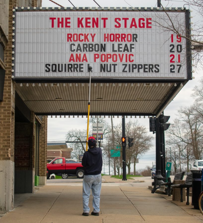 Ed Bzomowski fills the marquee outside The Kent Stage. Bzomowski has been a volunteer with The Kent Stage for 11 years. “I do this in all kinds of weather,” Bzomowski said, but he prefers the spring weather. 