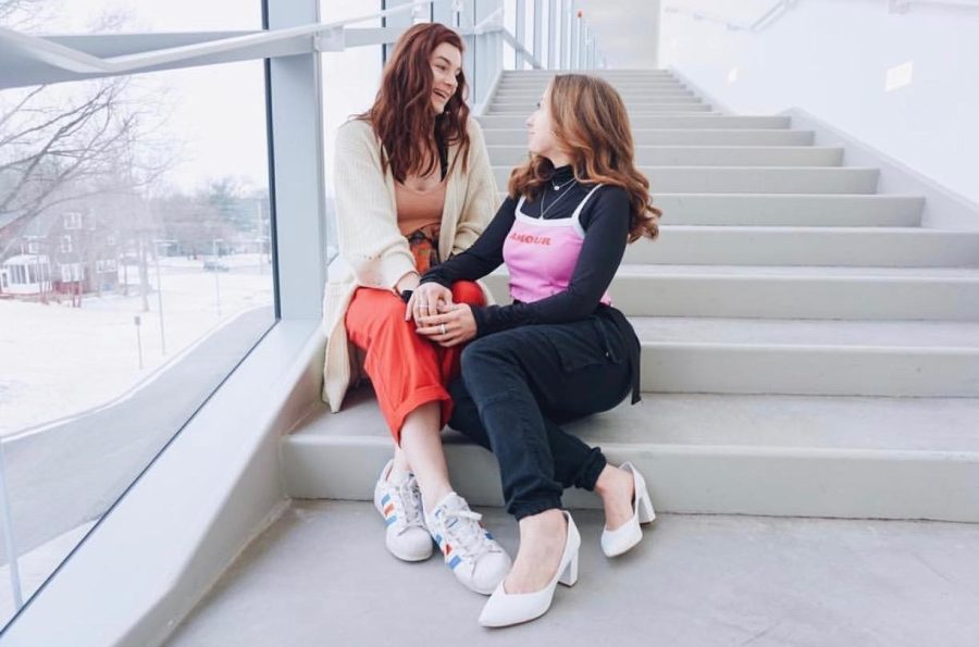 Makenzie Hackbarth (left) and Becca Faber (right) posing for one of the many pictures taken at a popular photo spot inside the Center for Architecture and Environmental Design