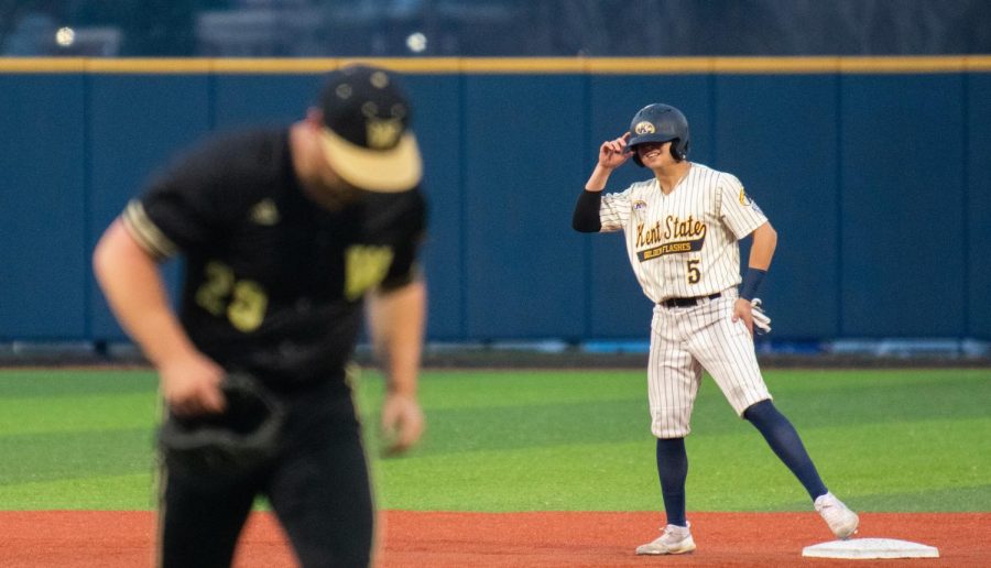 Sophomore Greg Lewandoski smiles as he stands on second base during Kent State's game against Western Michigan on April 5. The Flashes won, 9-5.