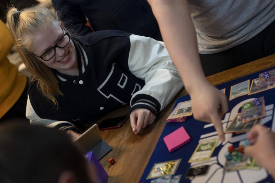 Natalie Shampay watches the last round of Pokemon games at Full Grip Games on April 10 2019. She often helps out on Wednesday nights with the livestreamed tournaments hosted at the card shop.