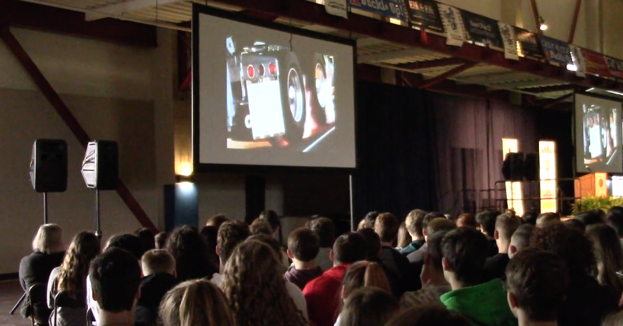 High school students watch a video about drunk driving at the None Under 21 event at Hiram College.