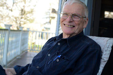 Chris Myers sits on his front porch. Known for being a prolific protester in the city of Kent, Myers said what city council members and university officials think of him. “I could care less what they think," he said. "It’s what other people think."