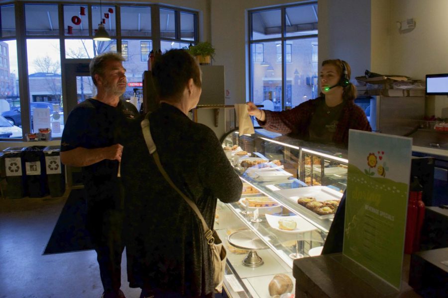 Tree City's Bre Horn serves pastries to customers on Wednesday, April 17, 2019.