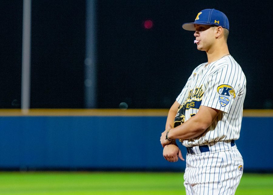 Redshirt sophomore Alex Ronnebaum blows a bubble while waiting on the field. Kent State won, 9-5, against East Central Michigan on April 5, 2019.