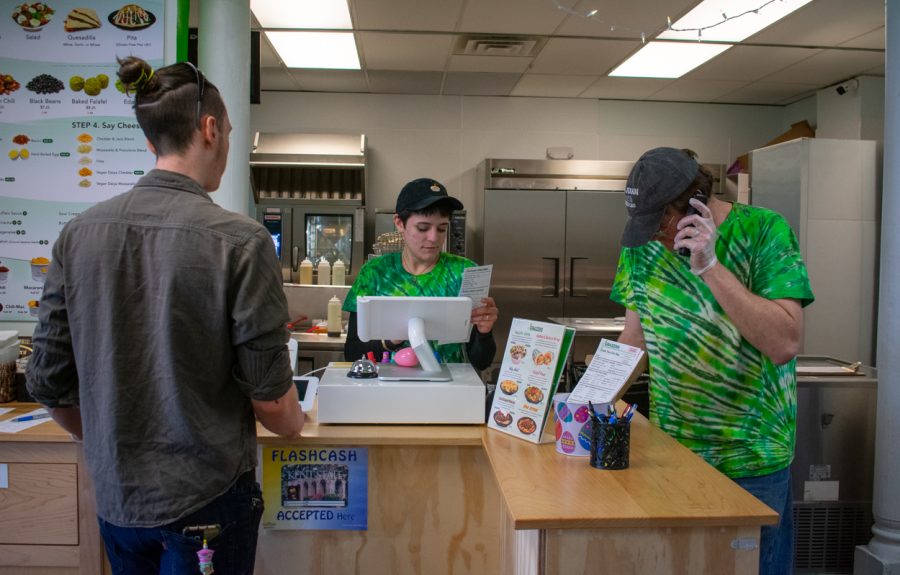 GRAZER employees take orders. Carl Bauer (right) is one of the co-owners.