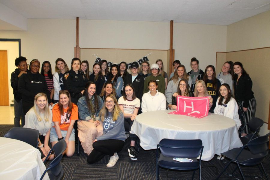 Members of Her Campus Kent State and Kent State Police Department pose for a photo on Monday.