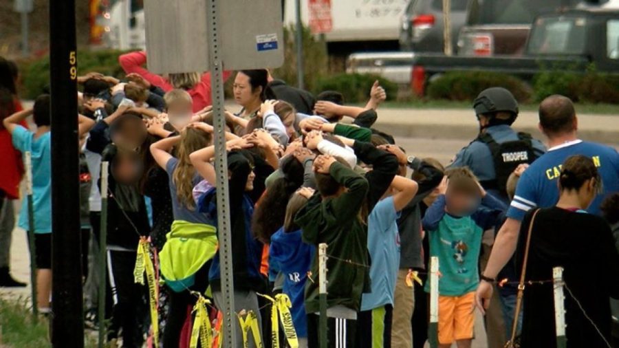 **Embargo: Denver, Colo.** Students line up outside, following a shooting at STEM School Highlands Ranch in Colorado Tuesday.