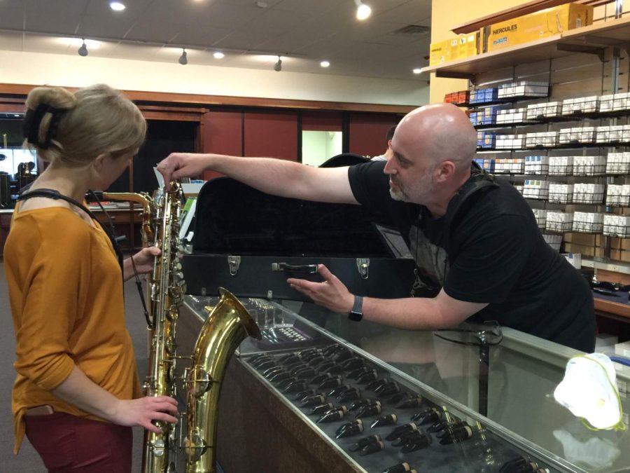 Woodsy's Music Staff Helping a Customer in the new 118 E. Main St. Location.