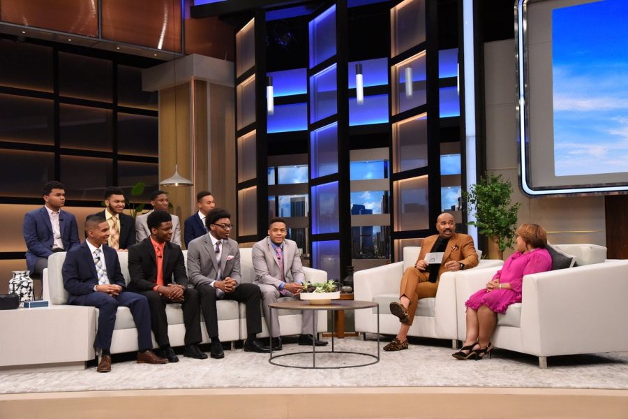 Steve Harvey speaks to Sonya Williams (far right) and the eight scholarship recipients who will be attending Kent State University this fall on his talk show "Steve" on May 9, 2019. 