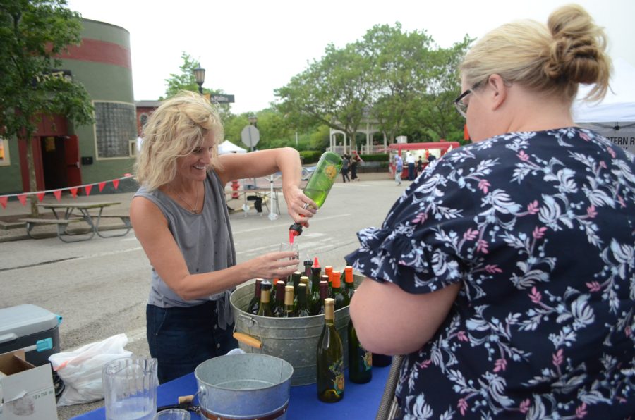 Nautivine Winery pours a sample of their apricot wine during Main Street Kent's Wine &amp; Art Festival held downtown on June 1, 2019.