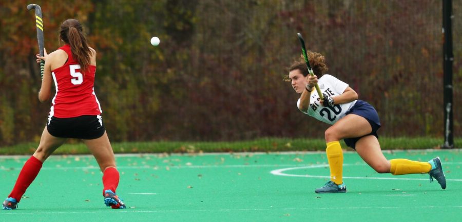 Kent State's Clara Rodriguez Seto hits the ball forward as Miami (OH)'s Paula Portugal prepares to block during the MAC Championship game at Murphy-Mellis Field Saturday, Nov. 4, 2017. The RedHawks beat the Flashes, 2-1, in overtime.