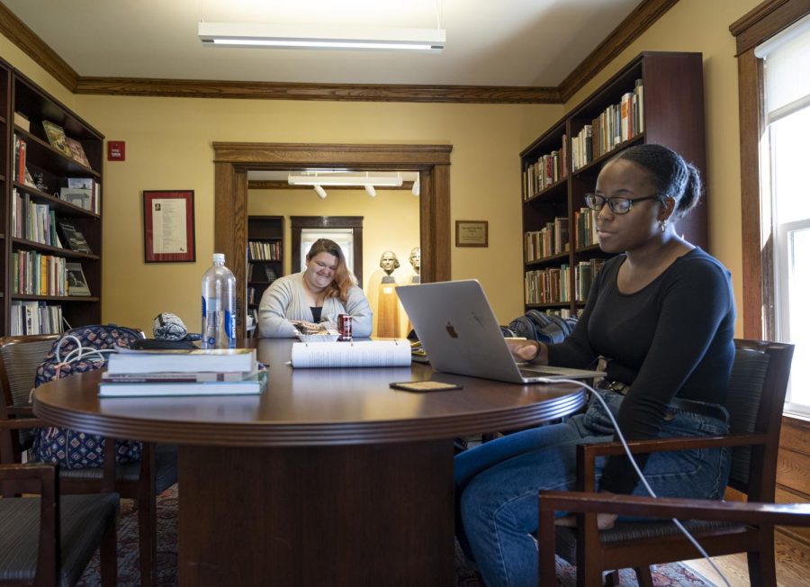 Junior English major Dorisha Hendrix, A Wick Poetry Center employee, and senior integrated language arts major Faith Payton work and talk in the May Prentice House on Thursday, Sept. 26, 2019. 