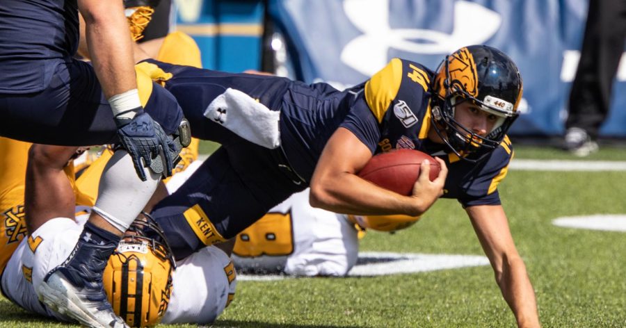 Junior quarterback Dustin Crum is tackled after running the ball during the final minutes of overtime of Kent State's first home game against Kennesaw State University on Saturday, September 7, 2019.