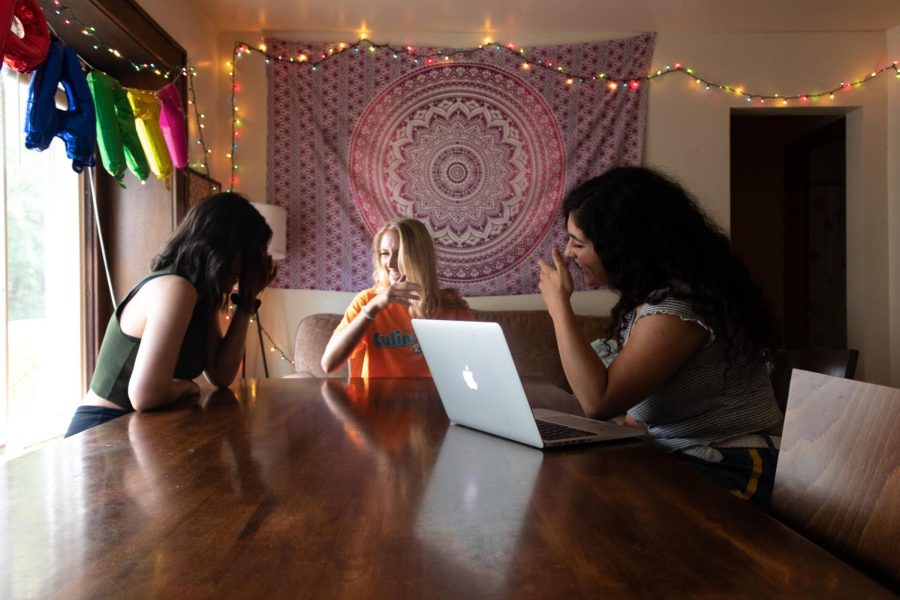 (From left to right) Junior fashion merchandising major Olivia Humer, junior education major Greta Schuster and senior advertising major Ariana Zingale laugh and talk in their shared home in Kent on Wednesday, September 4, 2019.