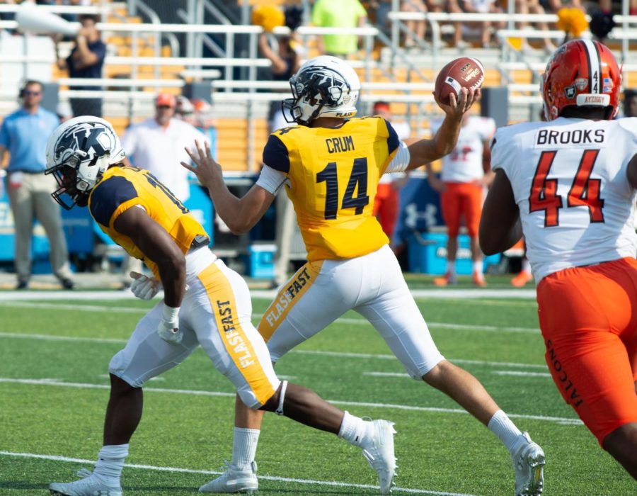 Quarterback Dustin Crum prepares to throw ball to teammates during homecoming game on Saturday, Sept. 21, 2019.