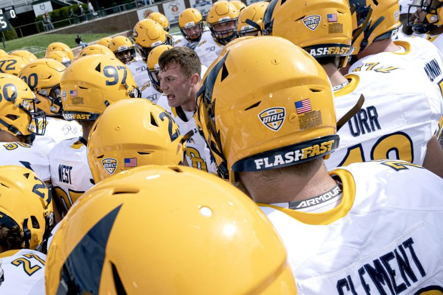 Graduate linebacker Matt Bahr leads the team's pregame huddle before Kent State's game at Ohio University on Saturday, Oct. 19, 2019