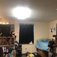 Mark's residence hall room that she decorated with posters in Centennial Court F. 