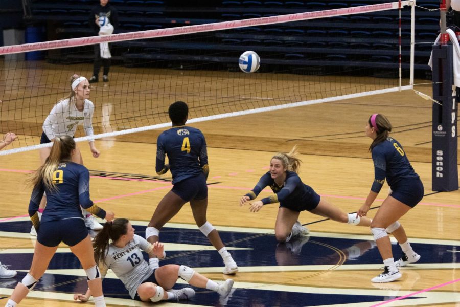 Kent Setter Natalie Tagala pops a ball back into play during the third set against Akron.