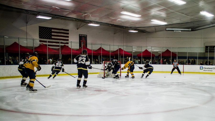 Kent State and John Carroll players fight over the puck during a 9-2 Flashes' victory at the KSU Ice Arena on Jan. 19, 2018. [FILE]