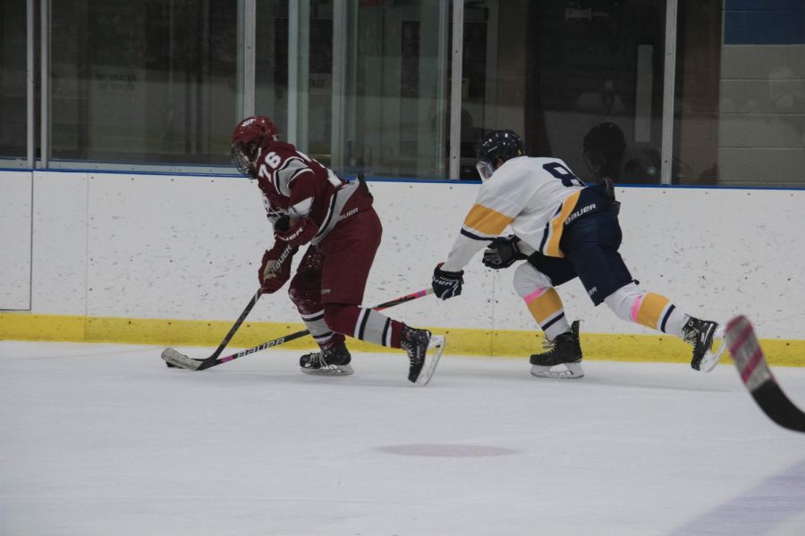 Giovanni Stellabotte #8 reaches to steal the puck from a member of the opposing team in the KSU v Indiana State game at the Kent Ice Arena on Oct. 19, 2019.