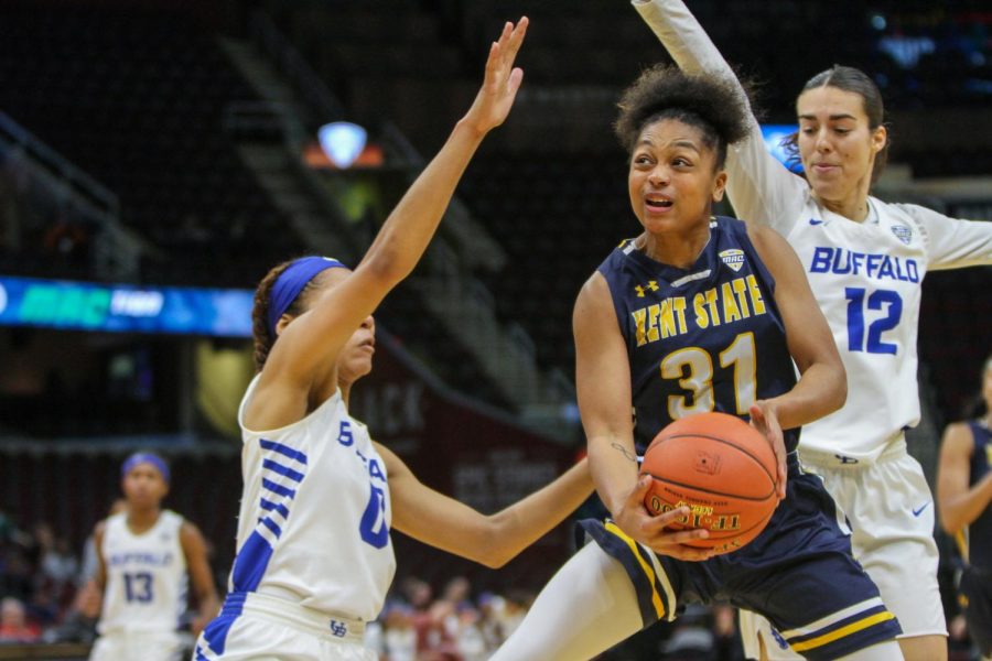 Junior guard Megan Carter attempts a layup against Buffalo’s tight defense during the second half on March 13 2019, Kent State lost, 85-52.  