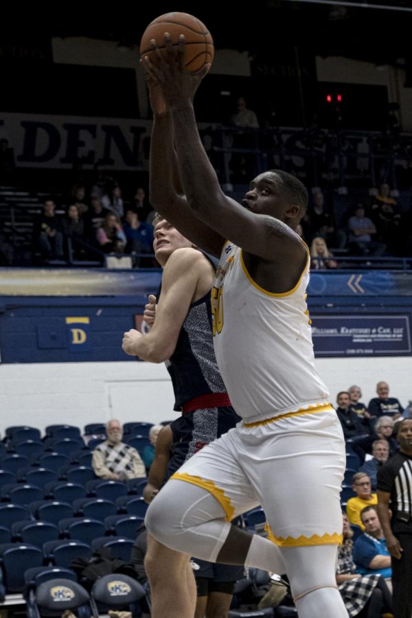 Kalin Bennet, freshmen center, rebounds the ball during Kent State's game against Hiram College on Wednesday, November 6, 2019.