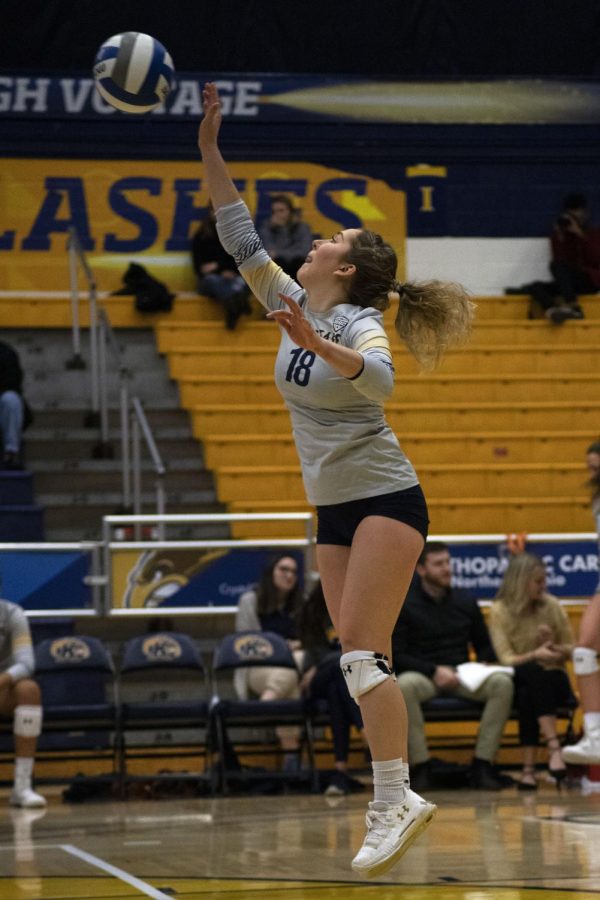 Defensive specialist Kaeleigh Stang, 18, serves the ball into play during the women's volleyball game on Nov. 15, 2019. The Golden Flashes won 3-0 against University of Akron.