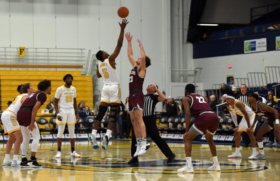 Junior Danny Pippen, 5, retrieves opening tip during start of game against Concord on Nov. 21, 2019. Kent State University won 89-59 against Concord University.