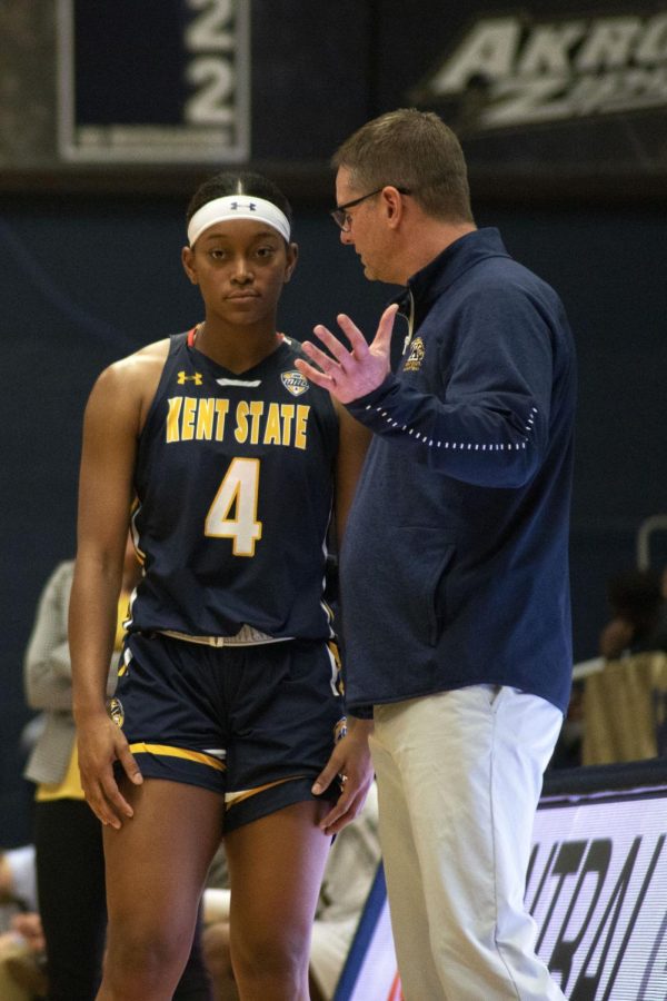 Freshman Nila Blackford, 4, talks to her coach Todd Starkey during a free throw in the women's basketball game against Purdue Fort Wayne. The Golden Flashes beat Purdue Fort Wayne 75-67 in the Akron Classic on Nov. 16, 2019.