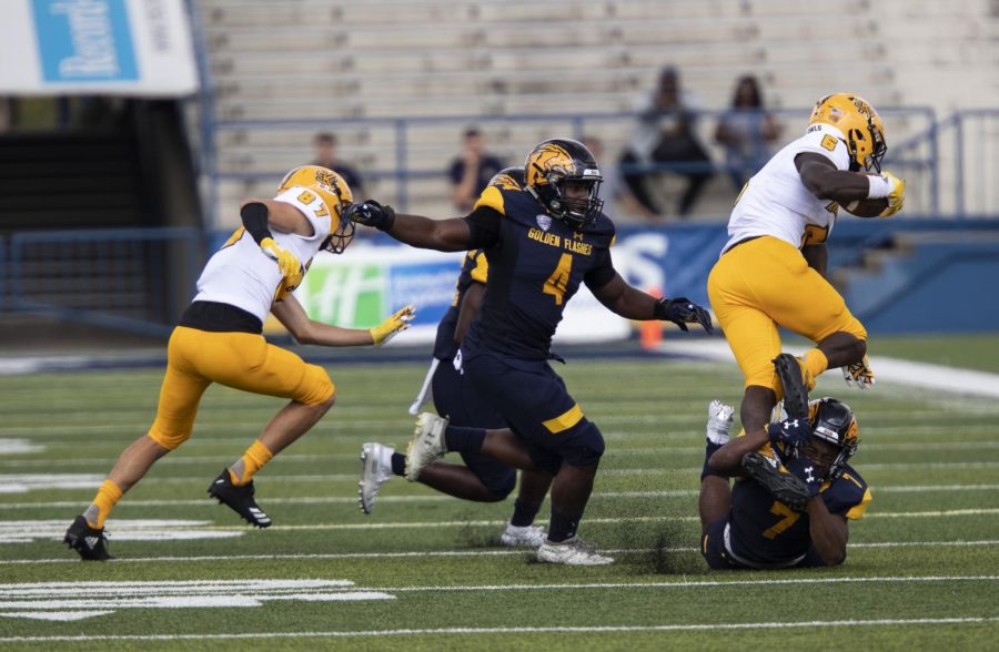 Senior cornerback Jamal Parker tackles running back TJ Reed during Kent State's first home game against Kennesaw State University on Saturday, September 7, 2019. The Flashes beat Kennesaw State 26-23 in overtime.