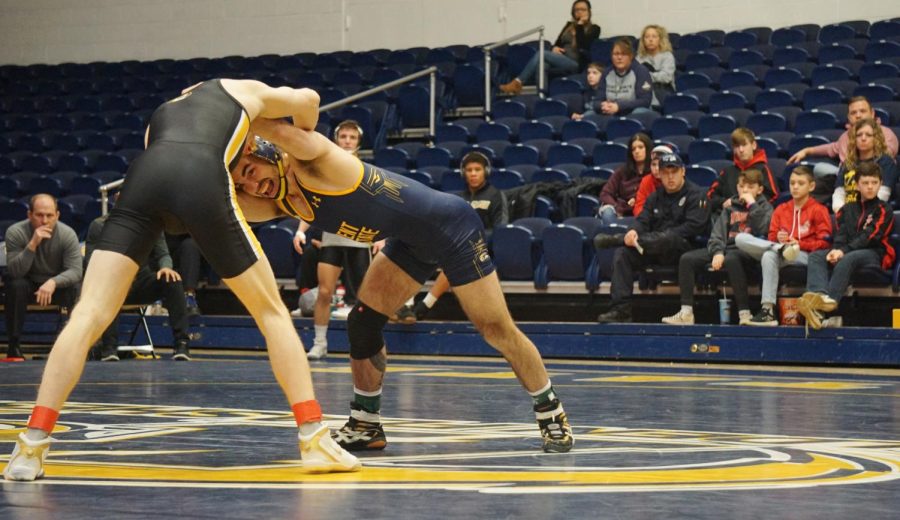 Fifth year senior Tim Rooney of Kent State grapples with Missouri's Allan Hart in the 133-lb. match at the M.A.C.C. on Jan. 19, 2020. 