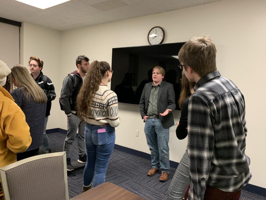 After the event on Tuesday, Jan. 28, congressional candidate Aaron Godfrey addresses student questions one on one.