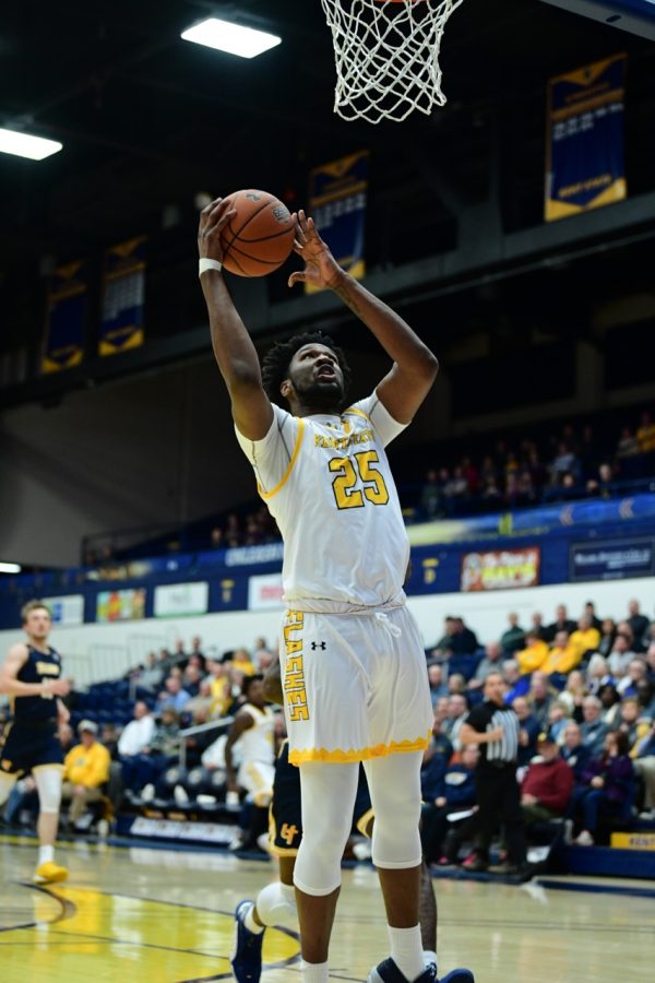 Senior forward Philip Whittington (25) shoots a layup on January 7, 2020. Whittington finished with 16 points and 10 rebounds in a 84-77 win.