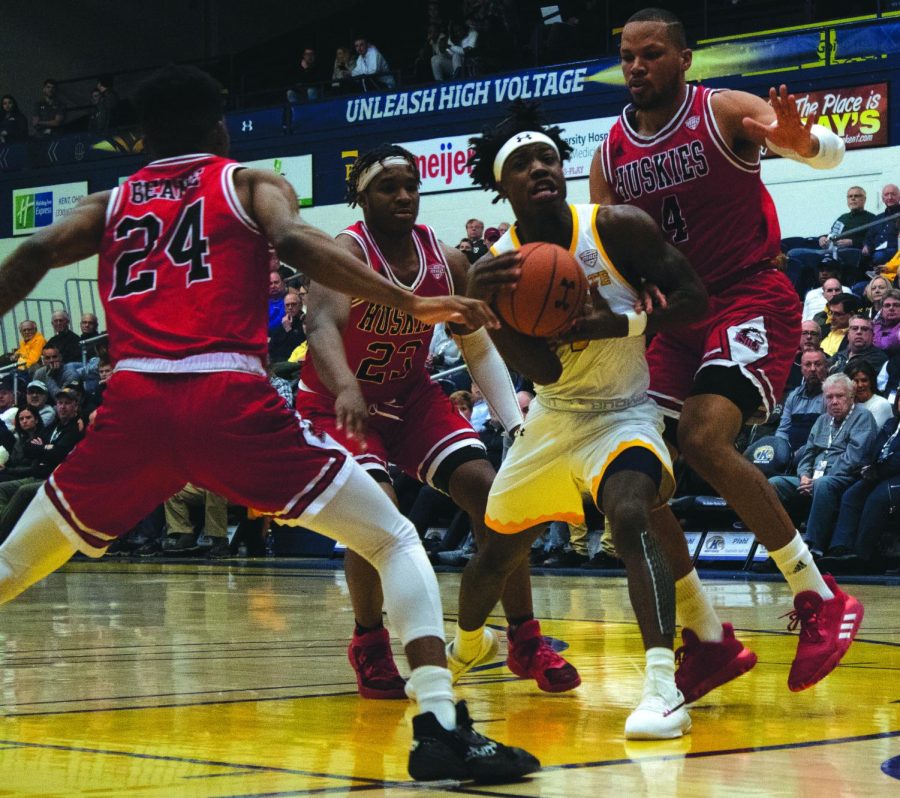 Senior guard Antonio Williams (4) attempts to pass the ball to a teammate. Williams scored 13 points on 4-for-10 shooting, but the Flashes went on to lose 76-69 to Northern Illinois on Jan. 21. 