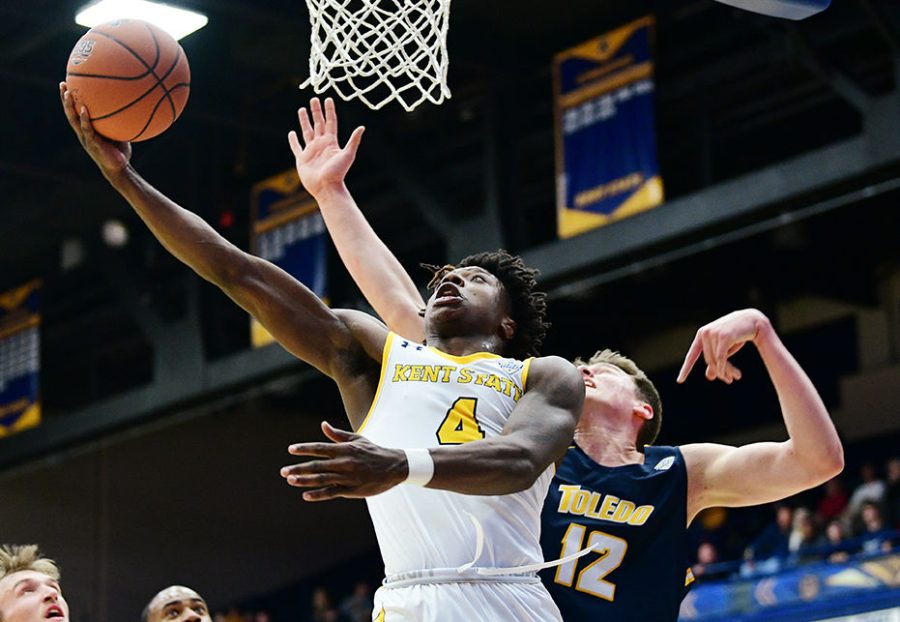 Antonio Williams (4) goes up for a layup against Toledo's Luke Maranka (12) on Jan. 28 at the M.A.C.C.