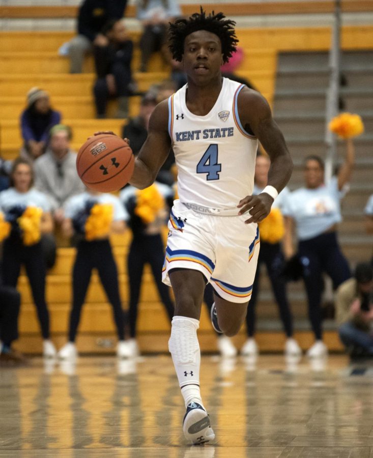 Senior Antonio Williams (4) dribbles ball down the court during first half against Ohio University on Sat. Feb. 15, 2020. Kent State University won 87-72 against Ohio University.