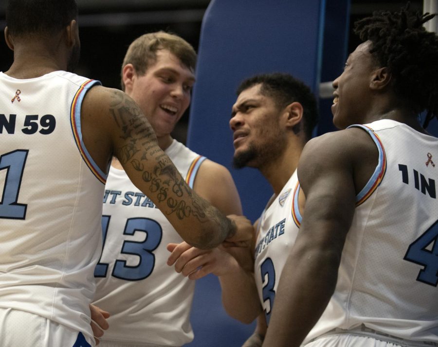 Senior Mitch Peterson [13] and senior Troy Simons [3] celebrate after Simons dunks, making the score 41-38 against Ohio Sat. Feb. 15, 2020. Kent State University won 87-72, as Simons scored a career-high 27 points.