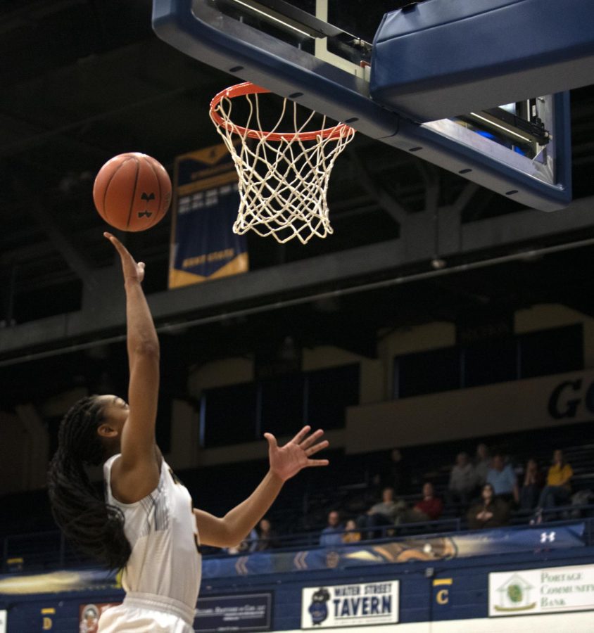 Senior Megan Carter [31] scores a basket making the score 18-12 against Miami University on Sat. Feb. 22, 2020. Kent State University won 80-75 against Miami University.