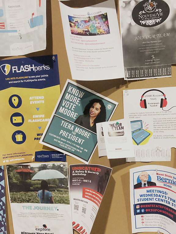 The campaign flyer for Tiera Moore, who is running for Kent State's Student Body President position, adorns a bulletin board in Franklin Hall.