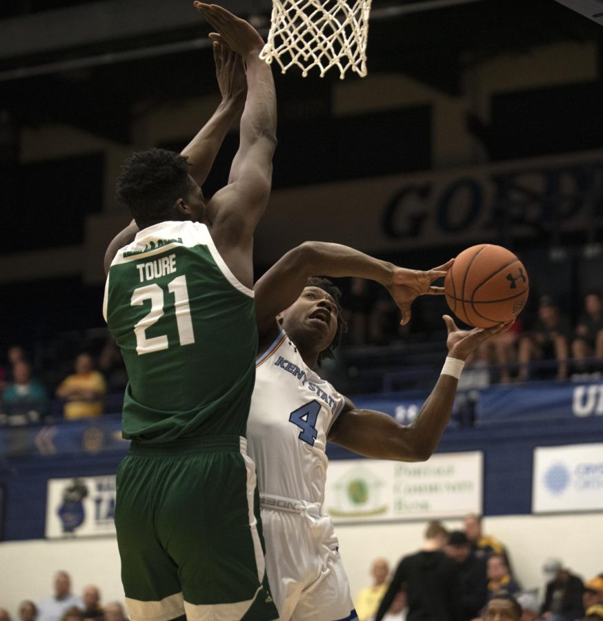 Senior Antonio “Booman” Williams (4) makes a shot giving the Flashes a 7-3 lead against Eastern Michigan on Mar. 9, 2020. Kent State won 86-76 allowing them to move on to the quarterfinals. Williams was the second highest scorer with a total of 18 points.