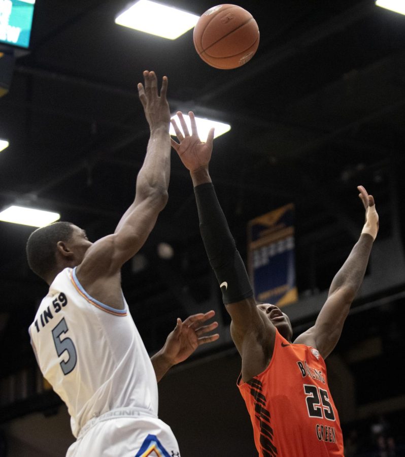 Junior Danny Pippen [5] shoots a basket making the score 2-5 against Bowling Green State University on Tues. Mar. 3, 2020. Pippen was the highest scoring with a total of 24 points. Kent State won 83-69 against Bowling Green State  University.