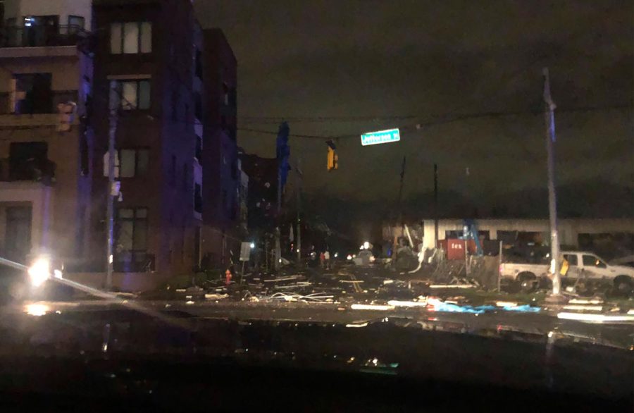 Debris scattered across an intersection Tuesday, March 3, 2020, in downtown Nashville, Tenn. The National Weather Service in Nashville confirmed a tornado touched down in the area. (Celia Darrough via AP)