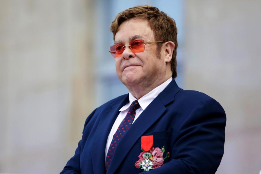 British singer-songwriter Elton John, seen addressing a crowd in the courtyard of the Elysee Palace in Paris, on June 21, 2019, will host a benefit concert on Fox on March 29.