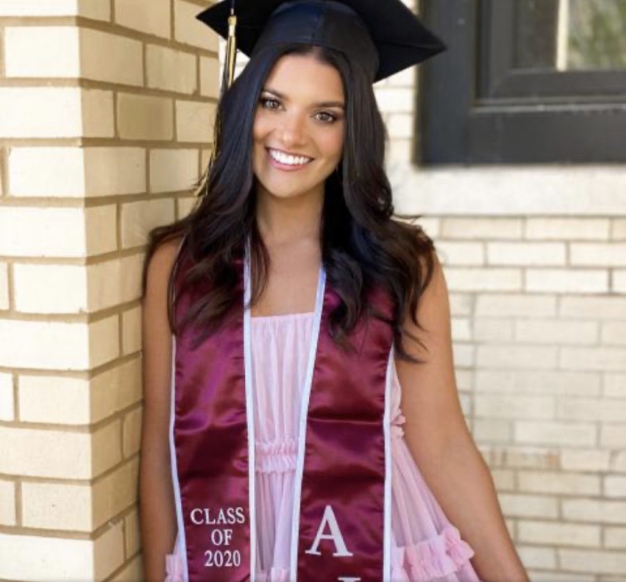 Recent fashion merchandising graduate Jenna Palek poses for a graduation photo. Courtesy of Jenna Palek. 