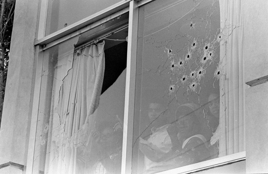 Students peer out of the bullet-riddled windows of Alexander Hall, a women's dormitory at Jackson State College in Jackson, Miss., after two African-American students were killed and 12 injured when police opened fire on the building, claiming they were fired upon by snipers, May 15, 1970. The shooting occurred after rioting broke out on the campus. (AP Photo)