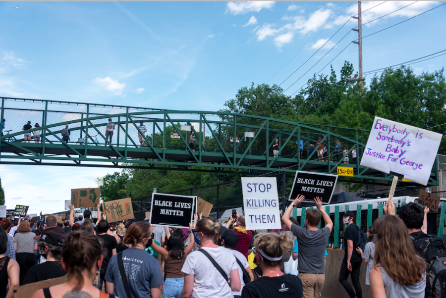 Protesters march down the streets in Clayton, Missouri on Saturday, May 30, 2020. 