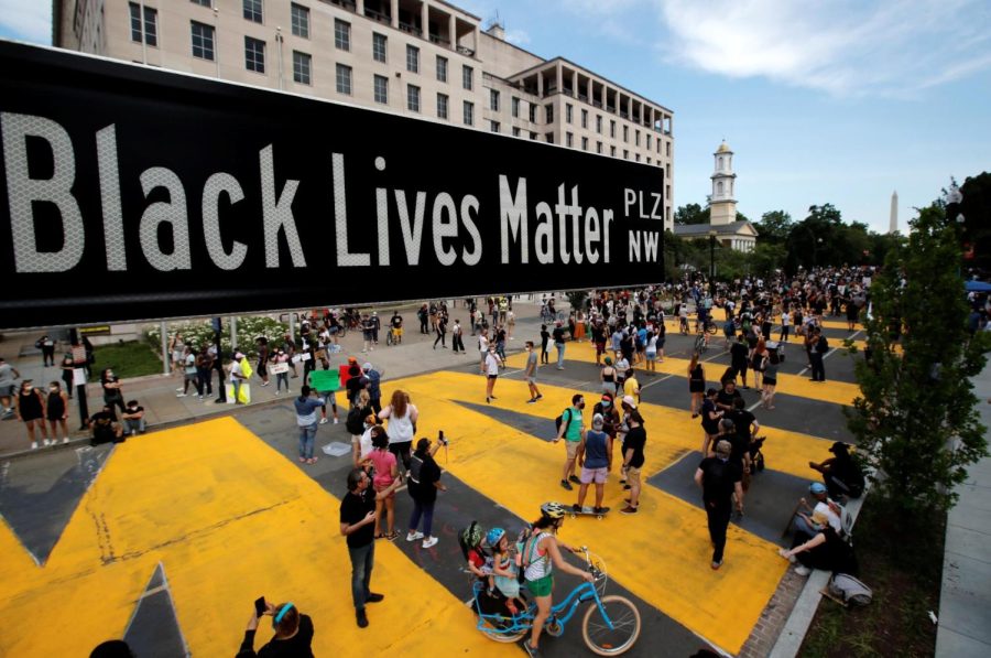 A street sign of Black Lives Matter Plaza is seen near St. John's Episcopal Church, as the protests against the death of George Floyd while in Minneapolis police custody continue.