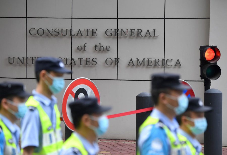 Policemen walk past the US consulate in Chengdu, southwestern China's Sichuan province, on July 26, 2020.